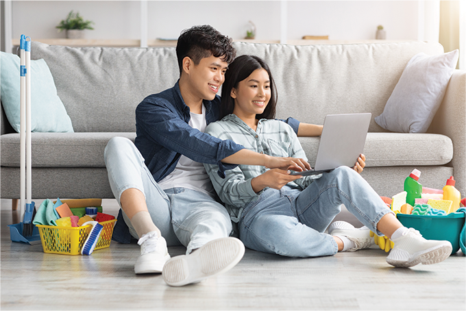 couple looking at computer spring clean your finances